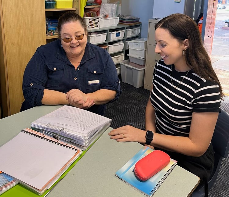 Supervising teacher and class teacher reviewing a reading intervention plan